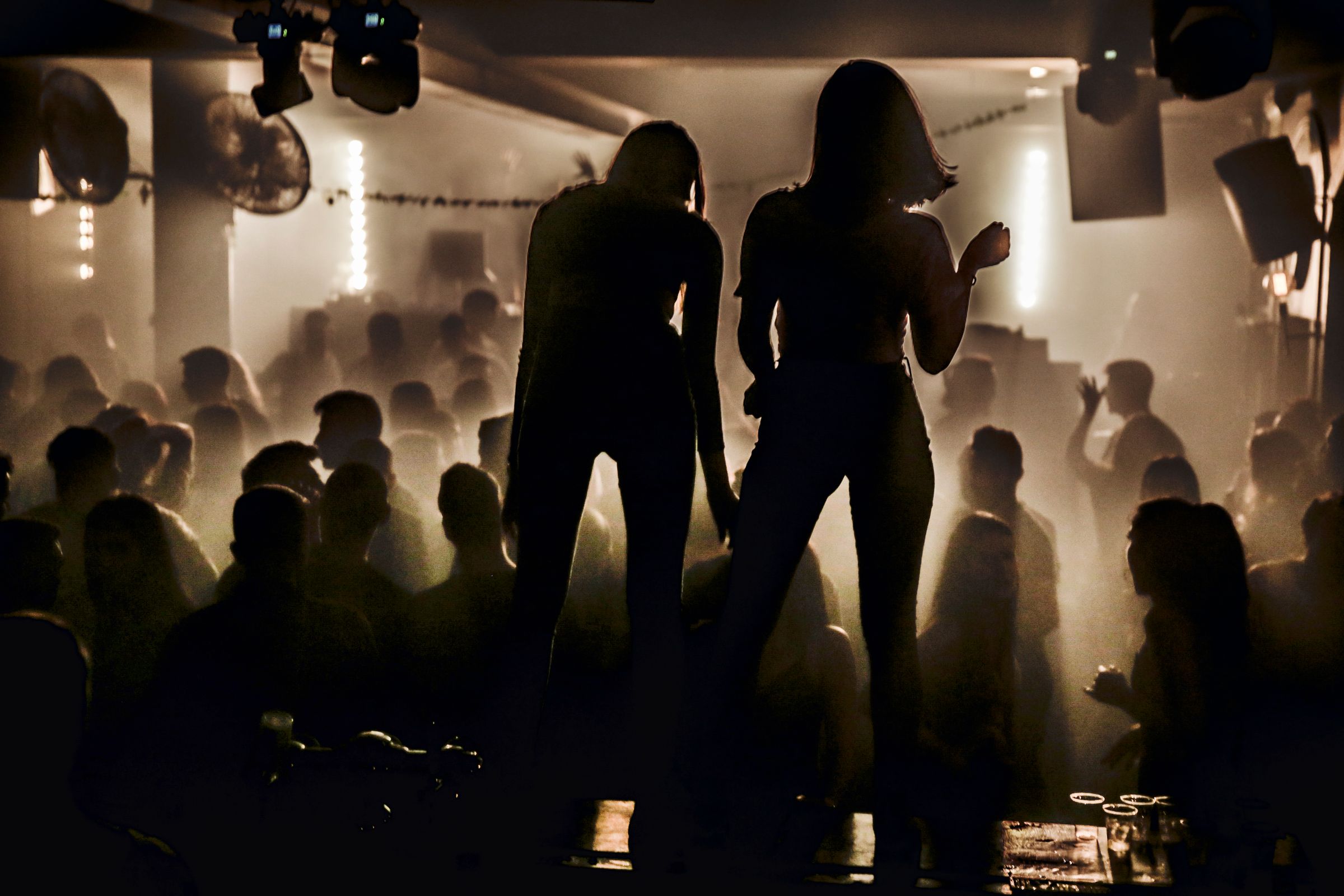 An intimate evening in a private members’ club, in low light
